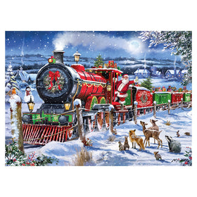 A festive Christmas winter scene featuring a red and green steam locomotive carrying Santa's gifts, with Santa Claus riding in the cab. Snow-covered ground, deer, trees, houses, and a full moon are visible in the background under a starry night sky.