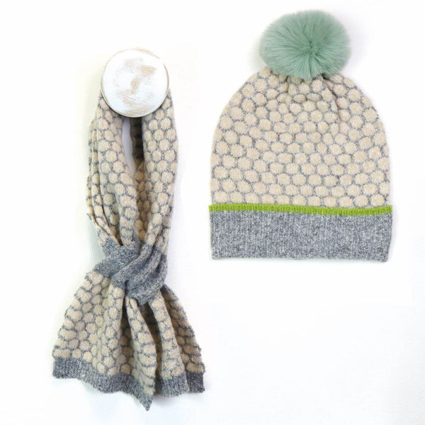 Hat and scarf with gray, beige and green colour on a white background.