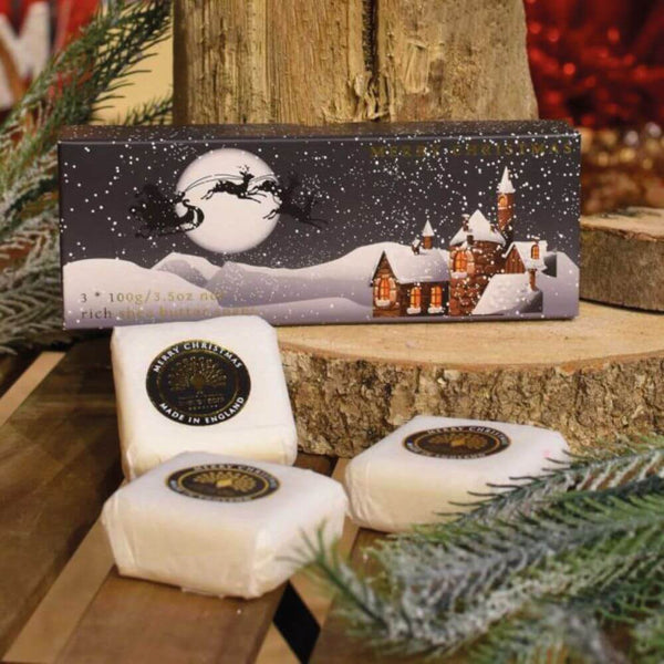 Set of three soaps bars and a gift box decorated with a nostalgic Christmas scene.