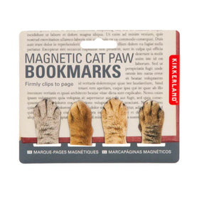 Magnetic cat paw bookmarks displayed on printed paper on a white background.