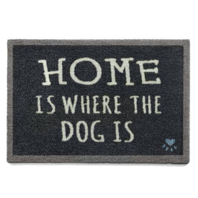 Doormat with 'Home is where the dog is' text on a white background