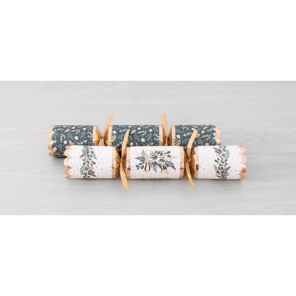 Two Christmas party crackers with floral patterns, tied together with ribbons, on a light gray surface.