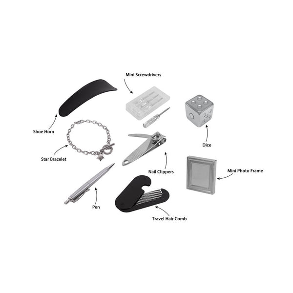 A set of miniature cracker accessories arranged on a white background with handwritten labels pointing to each item, including a shoe horn, star bracelet, nail clippers, pen, travel hair comb, dice, mini screwdrivers, and a mini photo frame.
