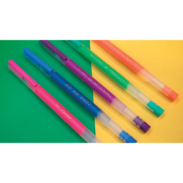 Colorful pens on a green and yellow background