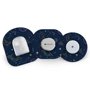 Three CGM sensors with galaxy design cgm patches on a white background