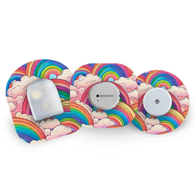 Three CGM sensors with rainbow and cloud design CGM patches on a white background