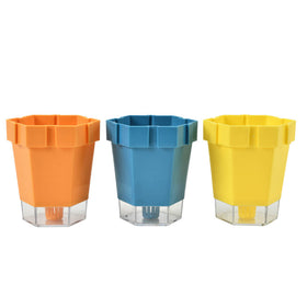 Set of three linked plastic plant pots in orange, blue, and yellow, each with a clear removable base.