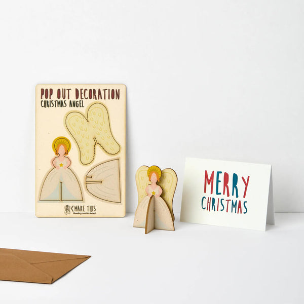 Pop-out angel Christmas decoration card featuring an angel with a golden halo and feathered wings, supplied with a blank Christmas greeting card and envelope.