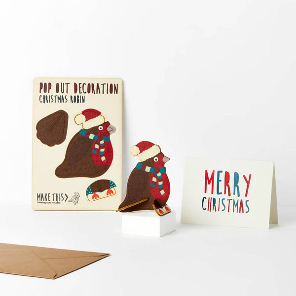 Pop-out robin Christmas decoration card wearing a festive hat and scarf, supplied with a blank Christmas greeting card and envelope.