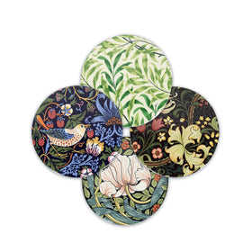 A set of four round stoneware coasters with different floral and animal patterns, placed on a white background.