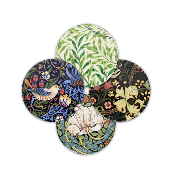 A set of four round stoneware coasters with different floral and animal patterns, placed on a white background.