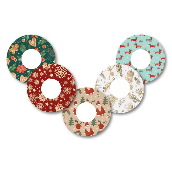 Christmas-themed Freestyle Libre 2 CGM patches (5 pack) featuring festive designs like Father Christmas and winter wonderland. Designed to protect and secure your device. Available from the Diabetes UK Online Shop.