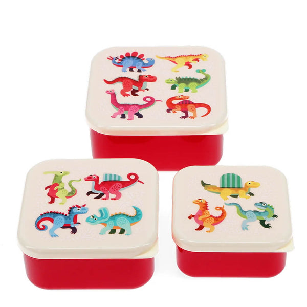 Set of three square snack boxes with dinosaur illustrations on a white background
