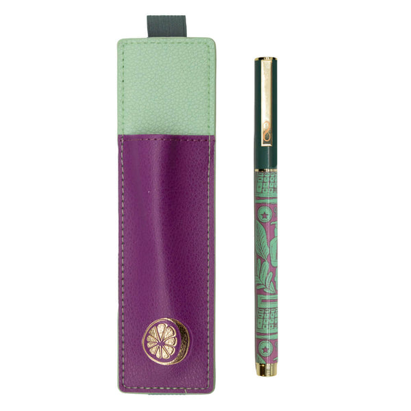 Pen with a green and gold design next to a purple and green case on a white background