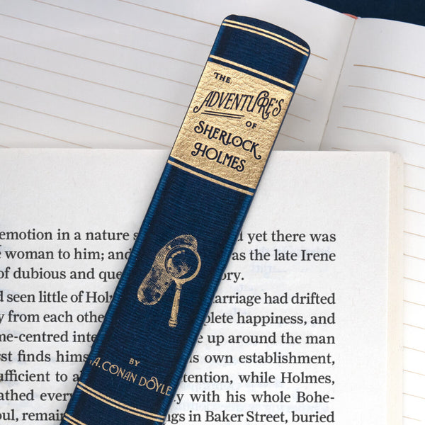Bookmark with 'The Adventures of Sherlock Holmes' on an open book