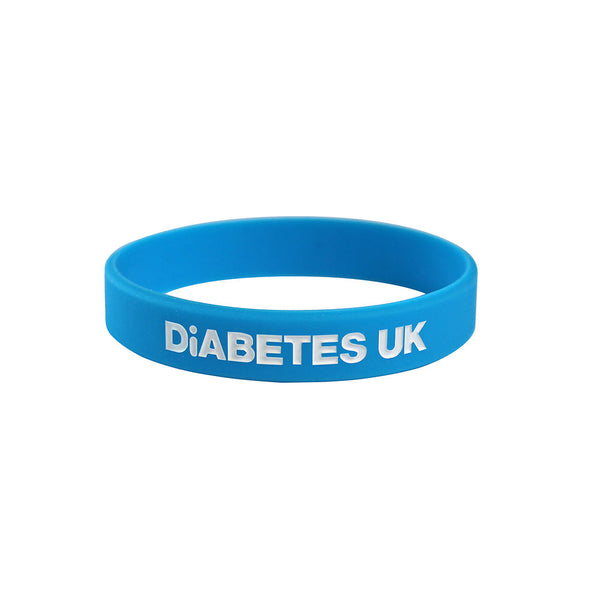 Diabetes UK light blue silicone wristband for diabetes awareness, one-size fits most, branded with logo.