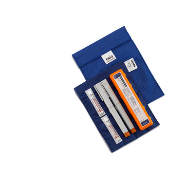 A blue FRIO large cooling wallet opened to display the storage compartments for temperature-sensitive medications such as insulin pens.