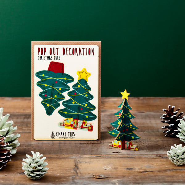 Pop-out Christmas tree decoration card featuring a decorated Christmas tree with colourful baubles, a gold star and presents, supplied with a blank Christmas greeting card and envelope.